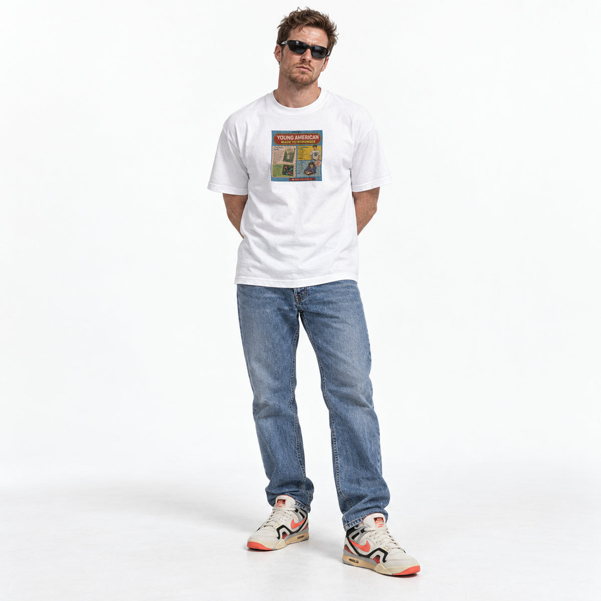 White scholastic book fair graphic tee with a colorful collage of literature and nostalgic art.