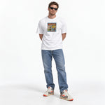 White scholastic book fair graphic tee with a colorful collage of literature and nostalgic art.
