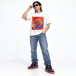 White Wacky Pomo Library tee with an orange circular doorway framing a colorful reading room, blue sofa and books.