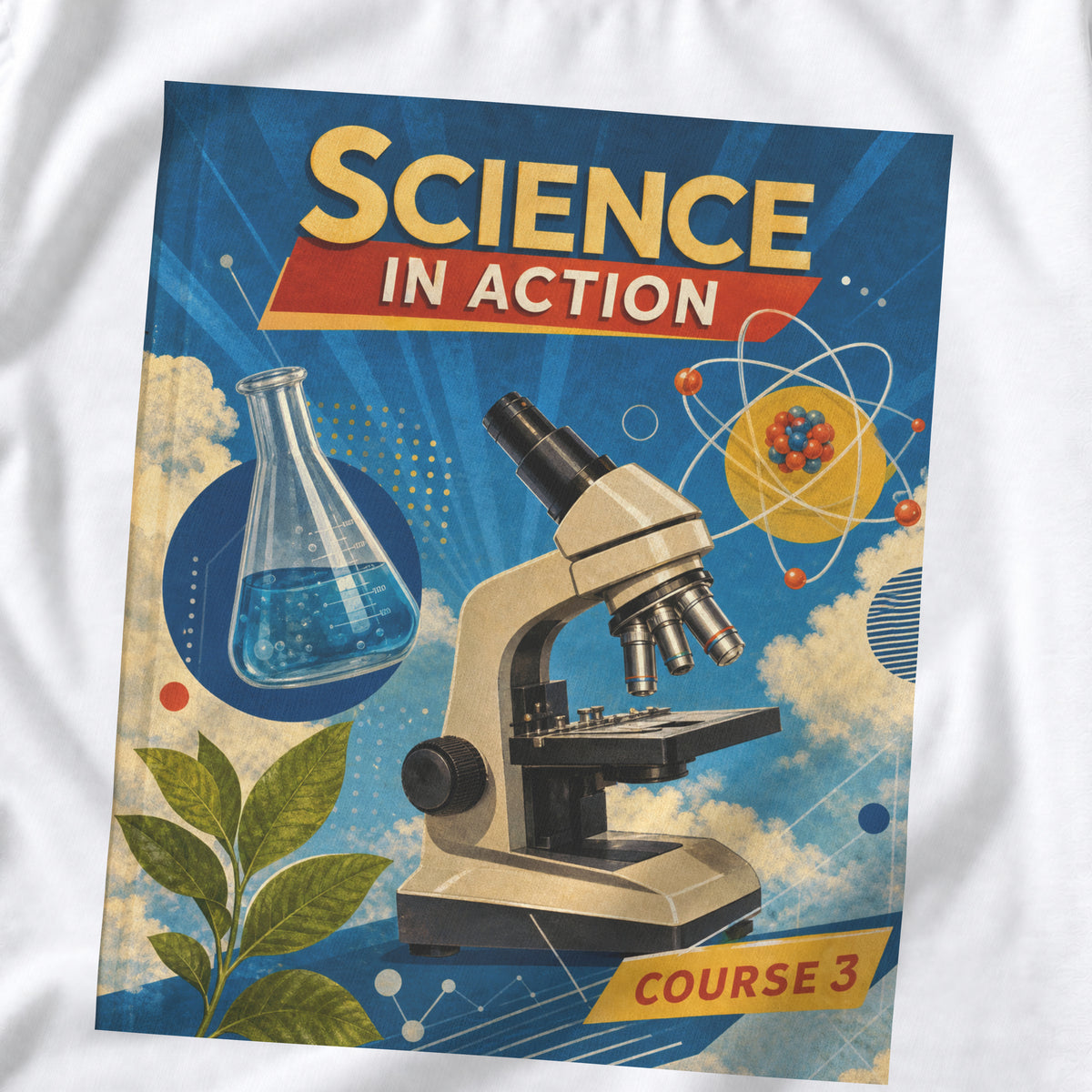 White Science Textbook tee with a blue "Science in Action" graphic featuring a microscope, flask and atom.